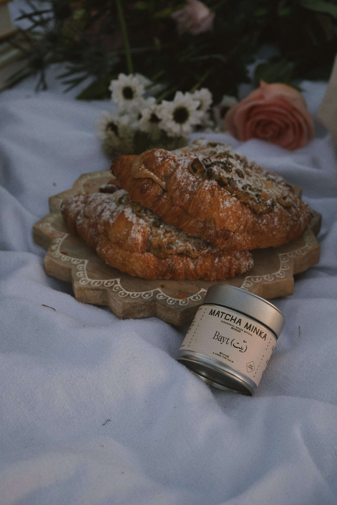 Matcha Minka tin with croissants and flowers