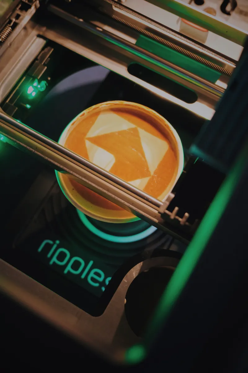 Latte art being printed with Ripples machine
